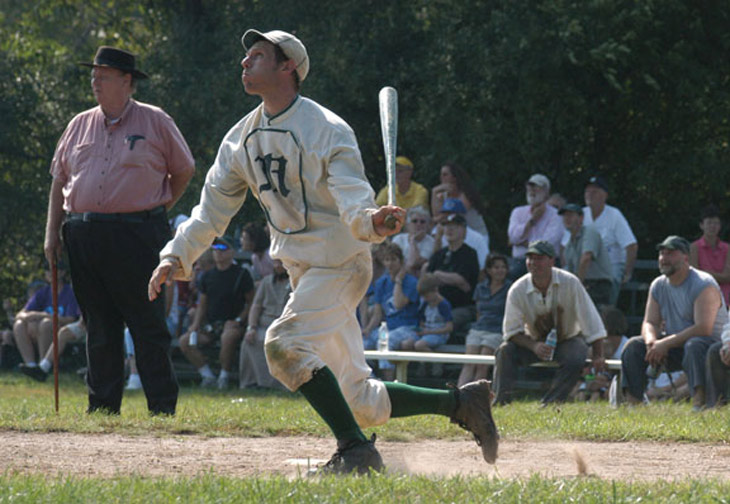 Vintage baseball photo: August 28, 2005 - Woodbury, CT.  Eric &ldquo;Express&rdquo; Miklich of the NY Mutuals BBC.  The 21st century NY Mutuals are committed to increasing the public's knowledge of 19th century base ball.  Being hired for community and public events, such as this 1864 match in Woodbury, allows the Mutuals to demonstrate various styles of play in the 19th century and lecture on the history and rules regarding baseballs beginnings. The Umpire shown in the photo is Harry Higham who is the great grandson of Dick Higham, professional baseball player and the NY Mutuals' first captain.  Photo by R.C. Shaw.  Click photo to return to previous page.