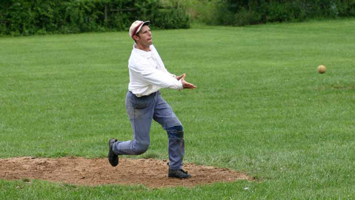Vintage baseball photo: 8/15/04: Eric &ldquo;Express&rdquo; Miklich pitches for the Knickerbocker Club during an 1864 match at Old Bethpage Village Restoration.  Photo by Bill Staskel. Click photo to return to previous page.