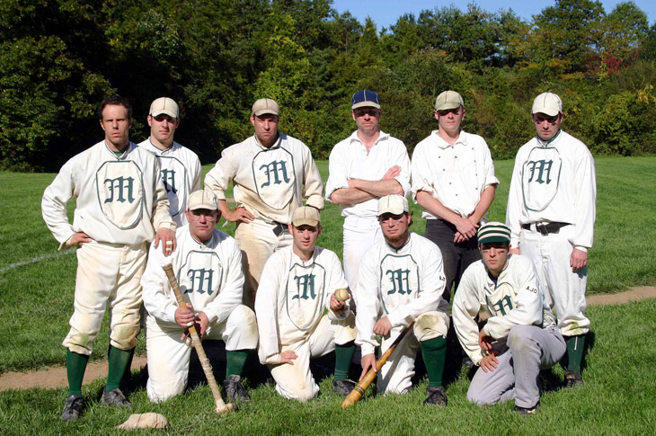 Vintage baseball photo: 10/08/06 - The New York Mutuals at Old Bethpage Village Restoration.  Standing (L to R): Eric &ldquo;Express&rdquo; Miklich, Rich &ldquo;Canada&rdquo; Harinsky, Ray &ldquo;Youngblood&rdquo; Hippeli, Chris &ldquo;Chops&rdquo; Lamb, Pete &ldquo;Wheels&rdquo; Halecky, Tom &ldquo;Kick&rdquo; Halecky.  Front Row (L to R): Tom &ldquo;Rabbit&rdquo; Blair, Tom &ldquo;Squid&rdquo; Jordan, Tom &ldquo;Dirt&rdquo; Fioriglio, Alex &ldquo;Guppy&rdquo; Banyazs.  Photo by Bill Staskel.   Click photo to return to previous page.