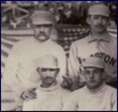 Detail from 1886 Boston/New York team photo. The only pitcher in the history of major league baseball to win 60 games in a single season, Charles &ldquo;Old Hoss&rdquo; Radbourn extends his middle finger towards the camera. Click to enlarge.