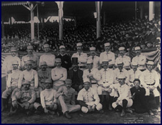 1886 Boston/New York team photo. Charles &ldquo;Old Hoss&rdquo; Radbourn is first from left standing with middle finger covertly extended. Click to enlarge.